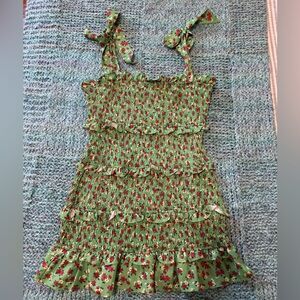 Green dress with pink floral pattern